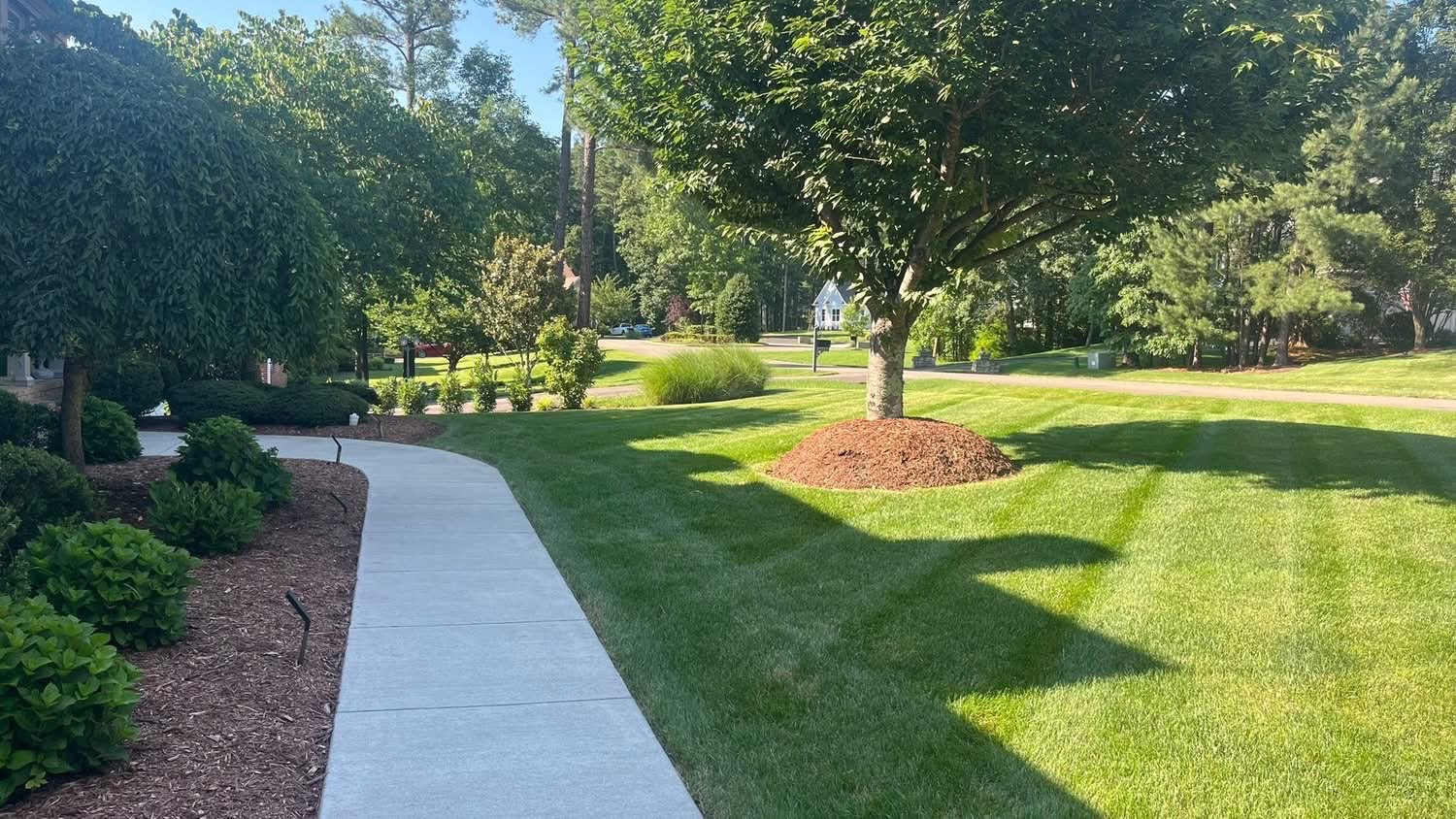 Front yard with professional diagonal mowing stripes